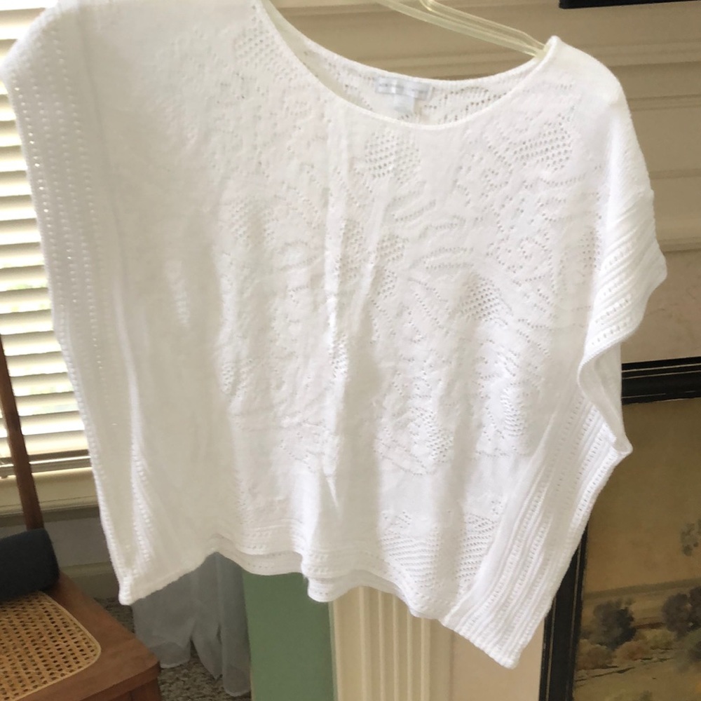 Deep armhole, sleeveless sweater.